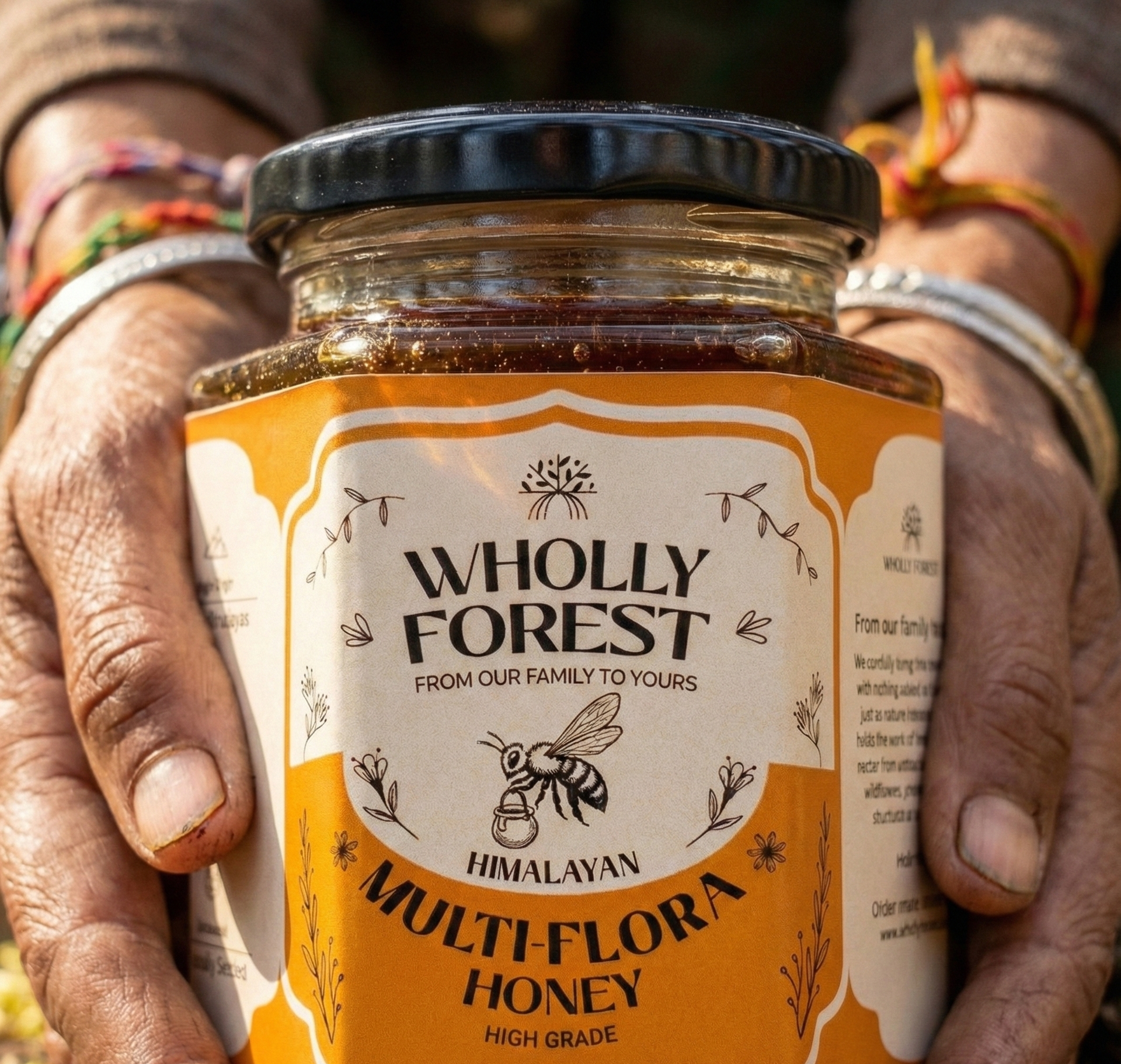 Jar of Wholly Forest Himalayan Multi-Flora Honey held by a person with colorful bracelets.