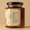 Wholly Forest Himalayan raw honey nutritional information table and purity guarantee back label showing zero added sugar